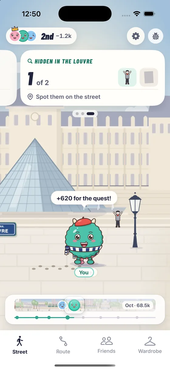 Mo on the street at the Louvre, with a card that reads Hidden in the Louvre, 1 of 2